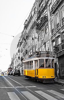 Yellow Tram in motion, Lisbon, Portugal photo