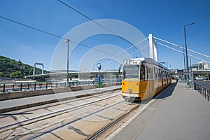 Yellow tram on the river bank of Danube in Budapest
