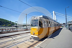 Yellow tram on the river bank of Danube in Budapest