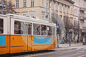 yellow tram on the street, public transport