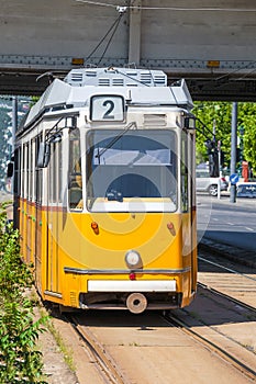 Yellow tram under Elisabeth Bridge in Budapest
