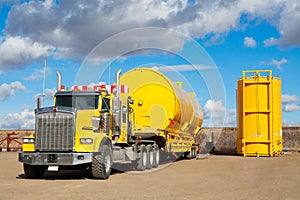 Yellow Transport With Oilfield Tanks photo
