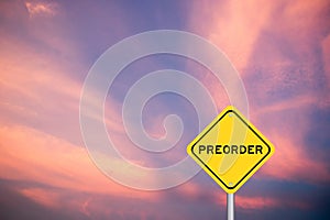 Yellow transportation sign with word preorder on violet sky background