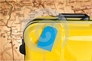 Yellow travel case with blue tage. Travel concept photo