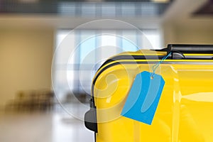 Yellow travel case with blue tage photo