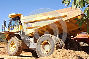 Yellow truck at a construction site