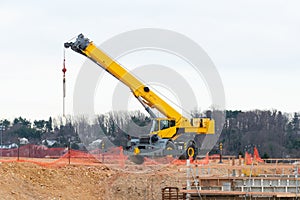 yellow truck crane construction site heavy