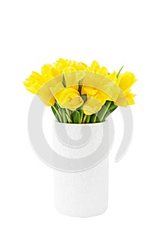 Yellow tulips bouquet in clay white vase isolated over white background with clipping path