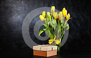 Yellow tulips on dark background