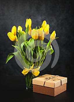 Yellow tulips on dark background