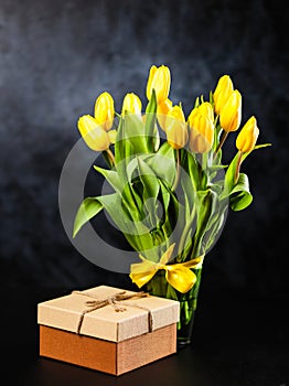 Yellow tulips on dark background