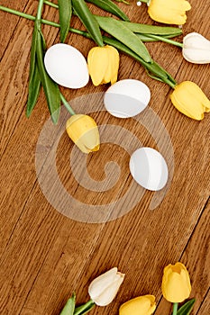 Yellow tulips white eggs easter decoration tradition