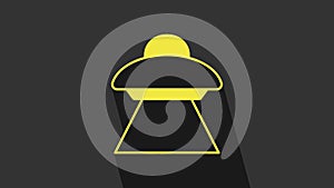Yellow UFO flying spaceship icon isolated on grey background. Flying saucer. Alien space ship. Futuristic unknown flying