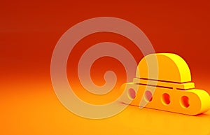 Yellow UFO flying spaceship icon isolated on orange background. Flying saucer. Alien space ship. Futuristic unknown