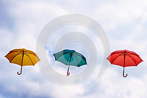 Yellow Umbrella, Green Umbrella and Red Umbrella floating in the Air