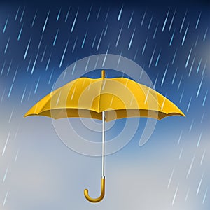 Yellow umbrella in rain