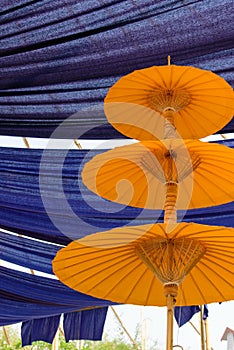 Yellow Umbrella Three layers. The backdrop of indigo fabric is b