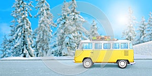 Yellow van on the road, with ski equipment on the roof