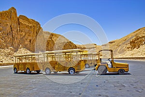 Yellow vehicle for tourists in Valley of the KIngs in Luxor, Egypt