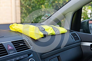 Yellow vest on a dashboard car in protest against tax increases