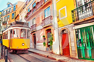 Yellow vintage tram on the street in Lisbon, Portugal photo