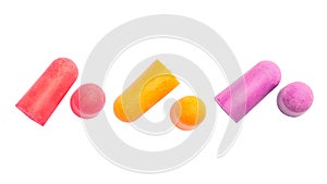 Yellow, violet and pink earplugs on a white background