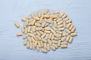 Yellow Vitamin Capsules. Vitamins, nutritional supplements, medicines, pharmacy, medicine and health concept