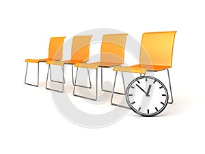 Yellow waiting chairs with classic wall clock