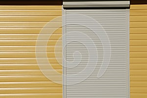 yellow wall, siding and shutters