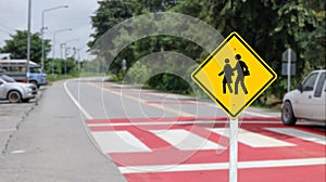 Yellow warn sign school zone to beware of children crossing the street to warn car to beware of people