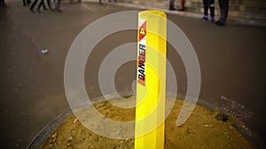 Yellow warning danger sign standing in the street, road works, maintenance