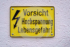 Yellow warning sign that alarms us for high voltage Switzerland