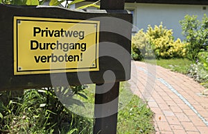 Yellow warning sign in the garden