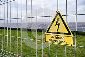 yellow warning sign Solar farms, capturing solar energy through photovoltaic panels, which contain solar cells convert sunlight