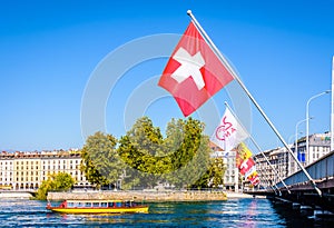 A yellow water bus and Swiss flags in Geneva