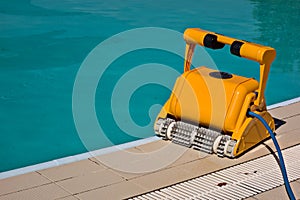 A yellow water cleaner for cleaning swimming pools