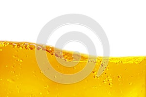 Yellow water surface with ripples and transparent bubbles on white background. Isolated