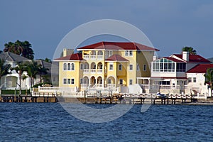 Yellow waterfront home. photo