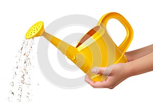 A yellow watering can in hand isolated on a white or transparent background. Water splashes and droplets pour out of the
