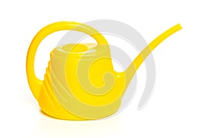 Yellow watering can isolated on white background
