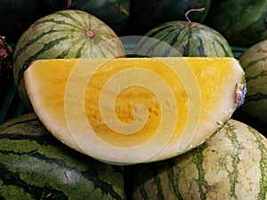 Yellow watermelon fruit in the basket in the modern market