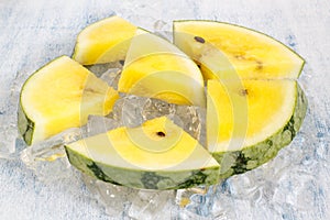 Yellow watermelon in ice cubes