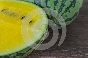 Yellow watermelon on table