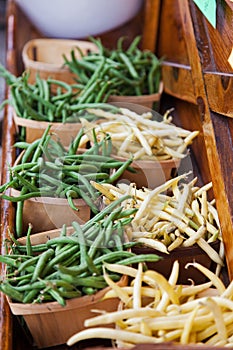 Yellow wax beans, and green string beans in baskets