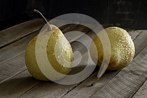 Yellow wet pear wooden background