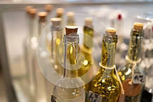 Yellow and white glass bottles in a shop