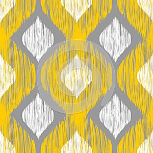 Yellow, white and grey rhomb seamless pattern in native ikat style. photo