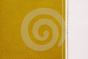 Yellow and white leather with decorative seam texture background