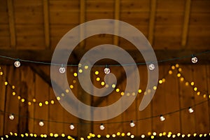 Yellow and White String Lights Hanging in a Barn