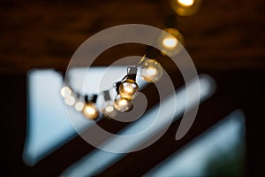 Yellow and White String Lights Hanging in a Barn